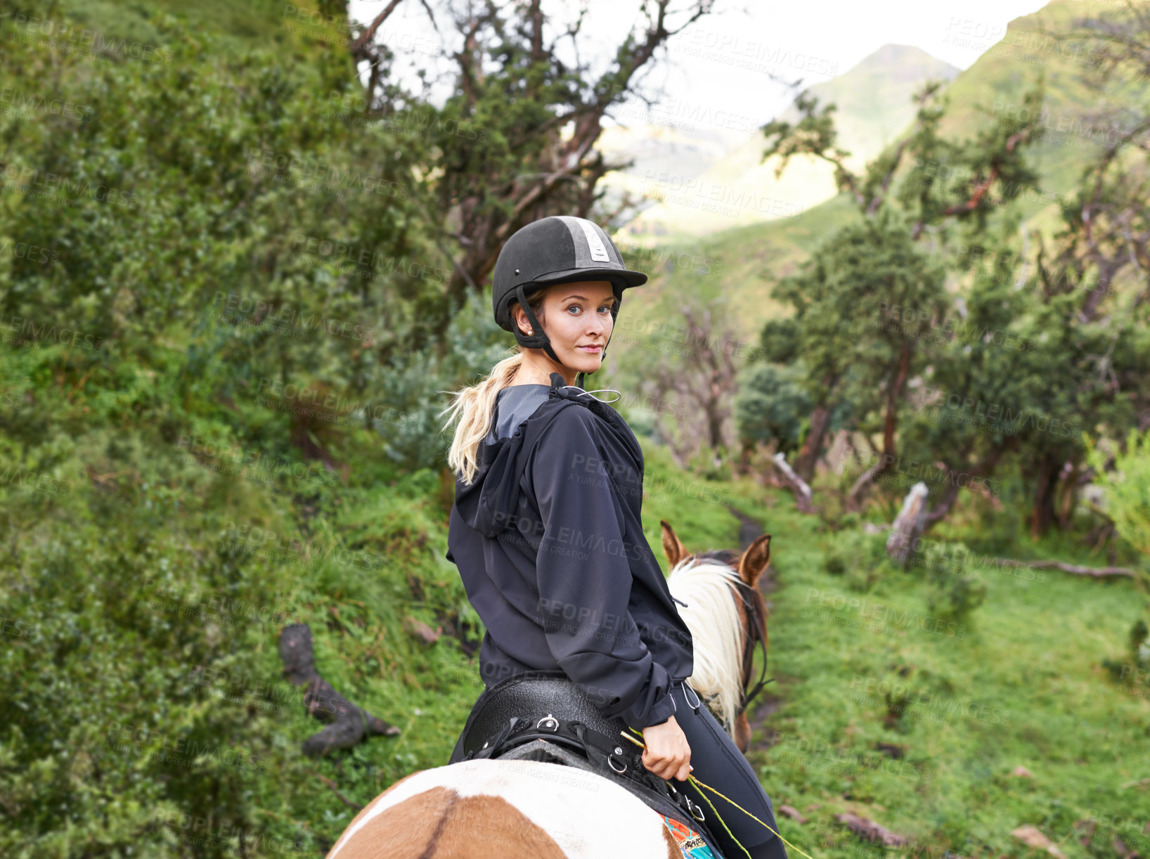 Buy stock photo Riding, horse and portrait of woman in forest or journey on path in nature for adventure and equestrian sport. Training, animal and person travel on trail with pet in countryside, woods and summer