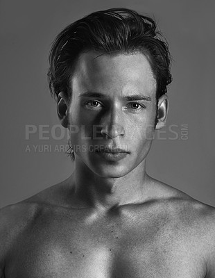 Buy stock photo Portrait, black and white with man, shirtless and confident guy on a grey studio background. Face, person and model with skincare and masculine cosmetics with shine or glowing with grooming or beauty