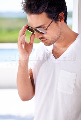 Buy stock photo Cropped view of a stylish young man wearing sunglasses