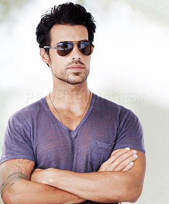 Buy stock photo Fashion, sunglasses and man outdoor with arms crossed, confidence and cool style on vacation. Summer, holiday and person with serious face in casual aesthetic in Miami and pride in Florida sunshine