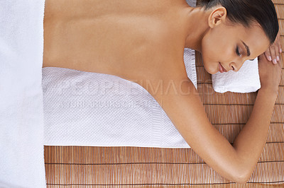 Buy stock photo Relax, massage and top view of woman at spa for skincare, peace and calm at table. Above, therapy and person at salon to pamper healthy body, care and beauty treatment for wellness at luxury resort