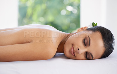 Buy stock photo Relax, calm and woman at spa for skincare, massage and peace at table to rest for zen at luxury resort. Beauty, therapy and young person at salon for healthy body, treatment and pamper for wellness