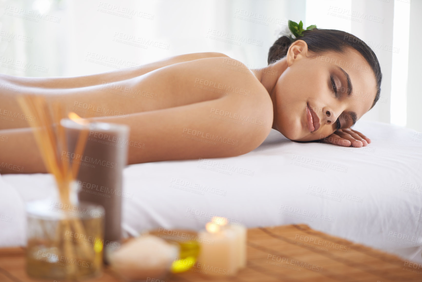 Buy stock photo Relax, peace and woman at spa for massage, skincare or calm at table to rest for aromatherapy at luxury resort. Beauty, therapy and person at salon for healthy body, treatment or pamper for wellness