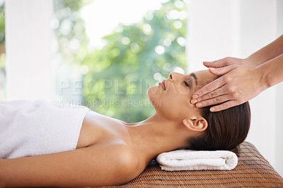 Buy stock photo A young woman receiving a face massage