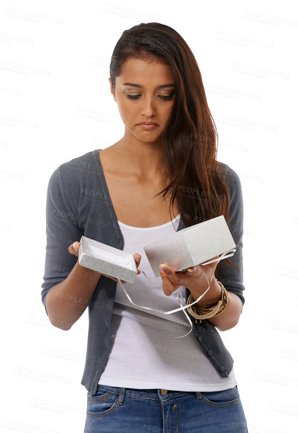 Buy stock photo Disappointed young woman holding an empty gift box against a white background