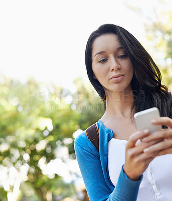 Buy stock photo Woman, typing and outdoor with phone at college for social media and walking with communication in park. Online, chat and girl with virtual contact on smartphone, connection and  networking in Paris