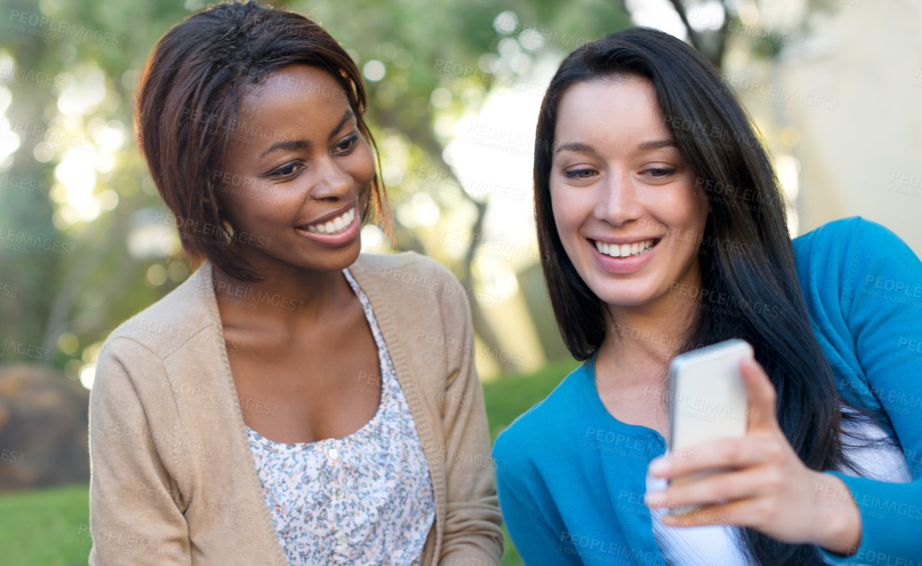 Buy stock photo Happy woman, student and friends with phone for social media, communication or outdoor networking. Interracial people or female person with smile on mobile smartphone for online chatting or texting