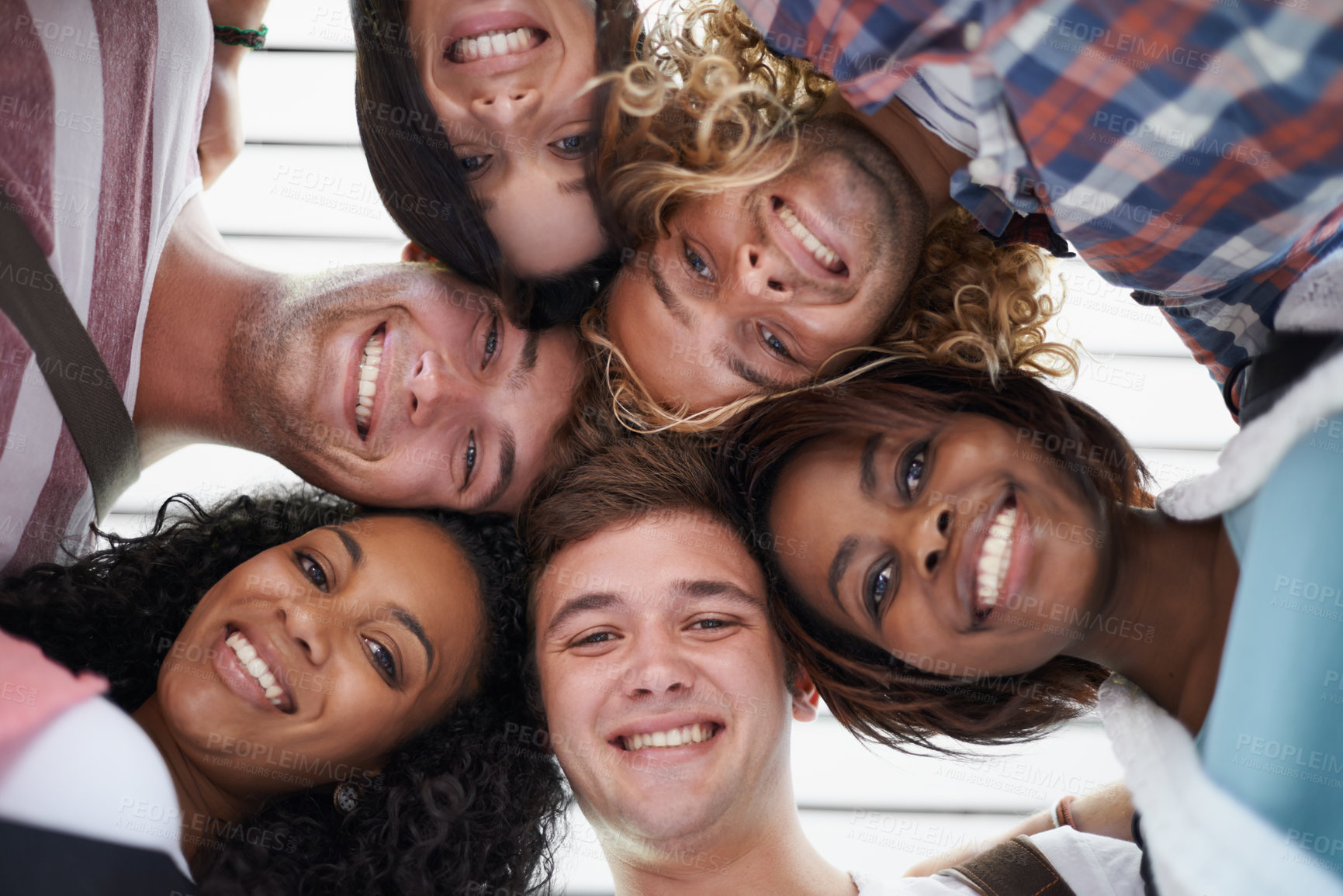 Buy stock photo Friends, students and huddle on college campus, portrait and solidarity at university and education. People, diversity and united below at school, academy and collaboration for studying in class