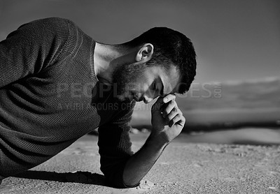 Buy stock photo Depression, sad or man in the desert thinking of travel in summer to relax on holiday vacation. Upset, black and white with face of male person on the ground with anxiety, monochrome or cool style