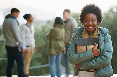 Buy stock photo Portrait of a young student standing outside with friends in the background