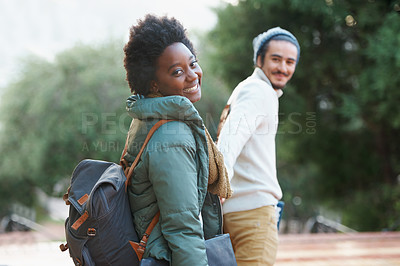 Buy stock photo Walk, park and interracial couple together holding hands with smile, bag and morning commute to university. College, students and romance on campus, man and woman with diversity, love and nature.