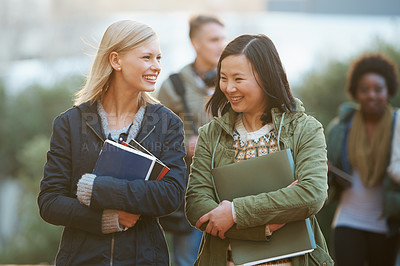 Buy stock photo Shot of a college students between classes on the campus grounds