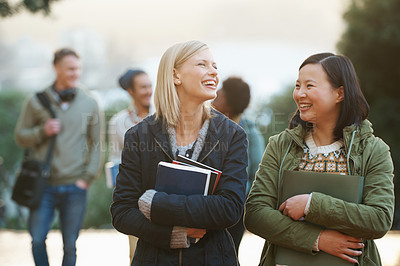 Buy stock photo Shot of a college students between classes on the campus grounds