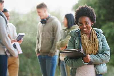 Buy stock photo Portrait of a young student standing outside with friends in the background