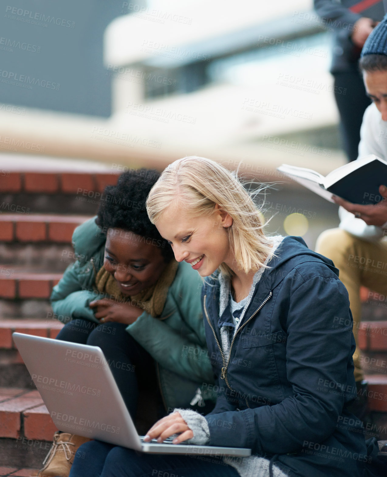 Buy stock photo College, women and laptop on stairs outdoor for research, relax or break on campus with social media. University, students and smile with technology for internet, streaming or learning and diversity