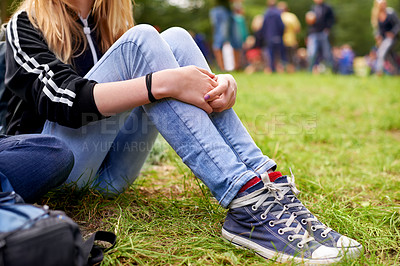 Buy stock photo Legs, shoes and person on grass closeup outdoor at event, festival or social gathering in green nature. Party, ground or field with casual woman sitting in forest, park or woods for entertainment