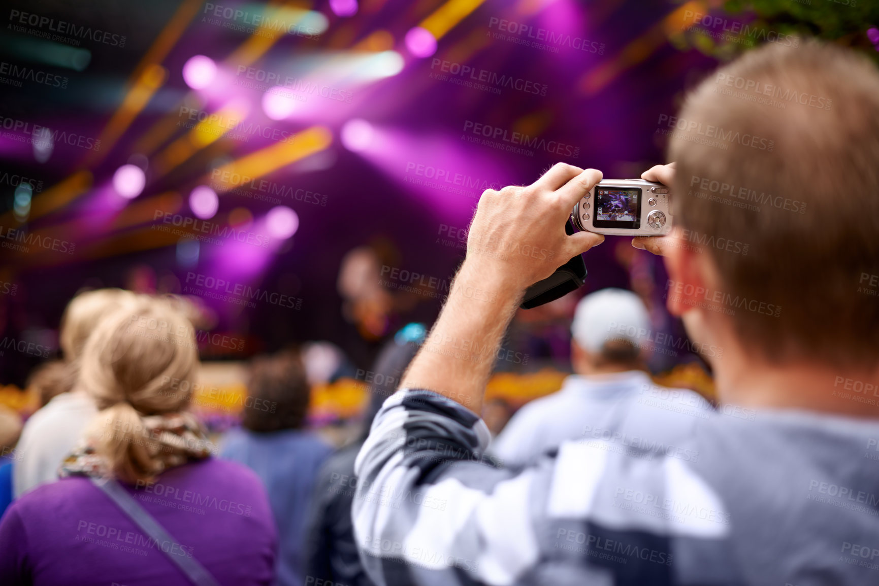 Buy stock photo Music, camera and party with man at festival for stage picture, social media and summer. Techno, photography or streaming at rave with male photographer in crowd for carnival, energy and rock event 