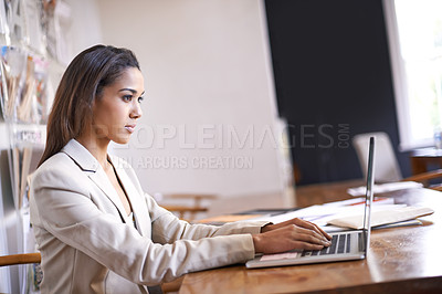 Buy stock photo African woman, desk and typing on laptop for small business, professional and thinking of idea for fashion. Black female owner, technology and research for styling design, career and entrepreneur