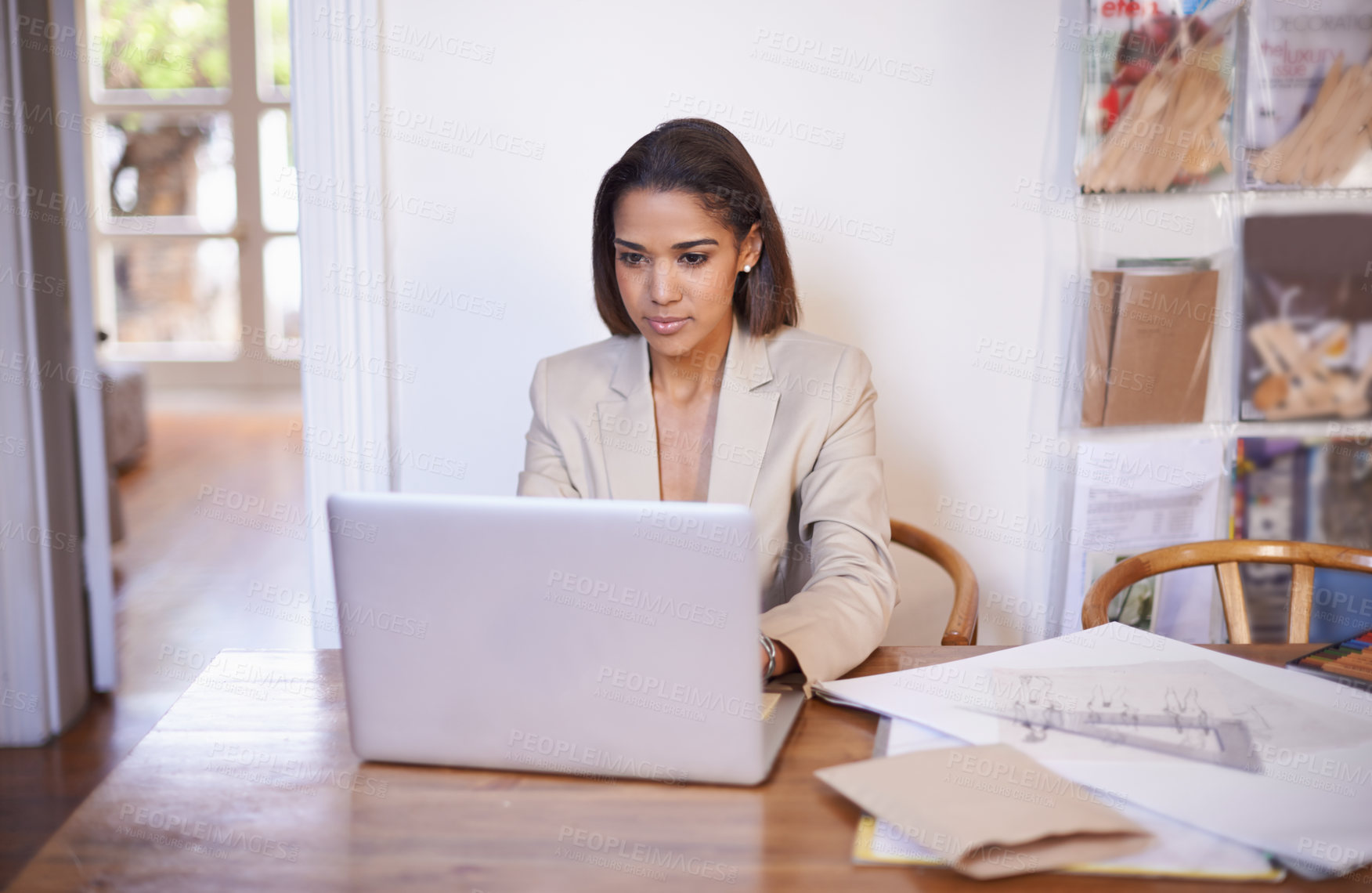 Buy stock photo Black woman, table and typing on laptop for small business, work from home and thinking of idea to design. African female owner, technology and research for styling, career and entrepreneur.