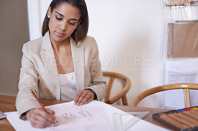 Buy stock photo Tailor, woman and drawing on paper with pencil in startup office of small business. Creative, serious person or fashion designer sketch at desk for illustration, planning or project ideas for clothes
