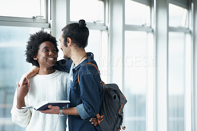 Buy stock photo Couple, hug and students with a book, education and conversation for research and embrace. College, man and woman with ideas or brainstorming with planning and teamwork with knowledge and learning