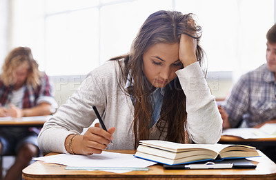 Buy stock photo University, classroom and woman with stress for exam, education and opportunity. College, learning and tired student with book, fatigue and anxiety for test, assessment or studying report with notes.