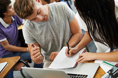 Buy stock photo A young male and female student studying in a classroom