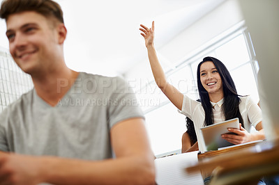 Buy stock photo A young woman raising her hand as she sits in a varsity class surrounded by her peers