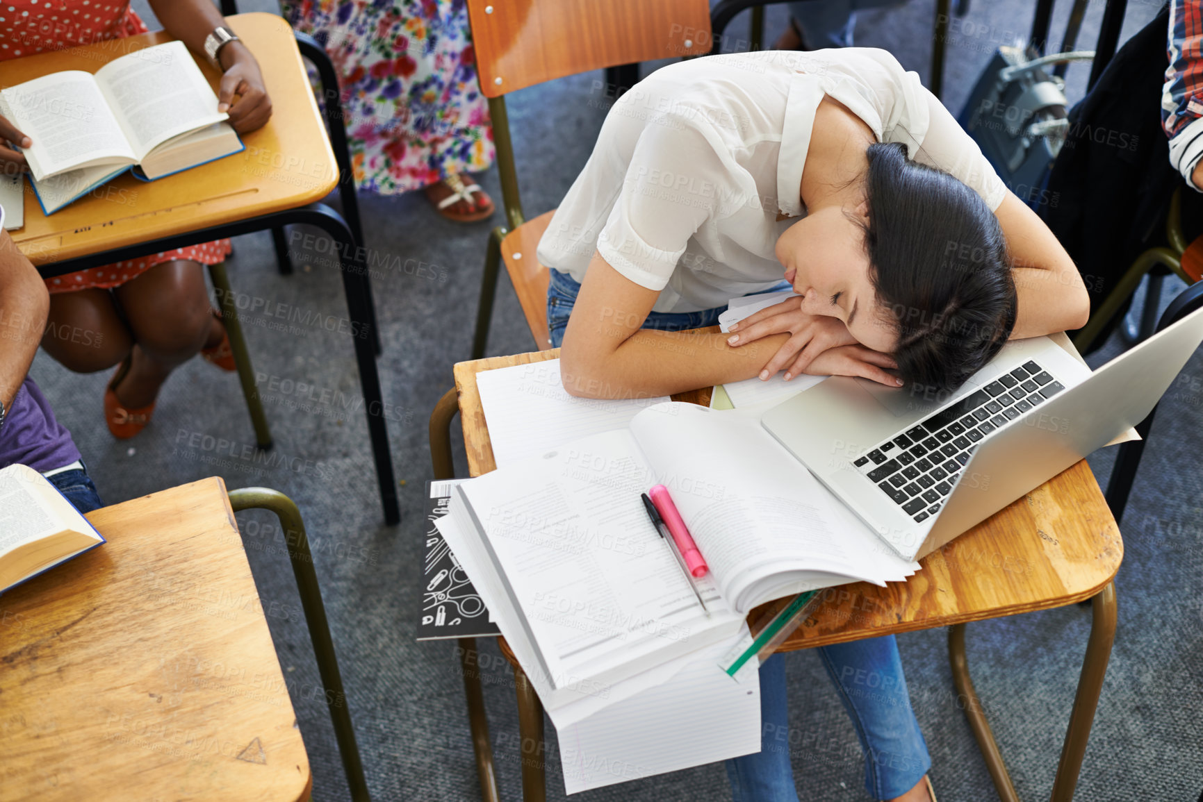 Buy stock photo University, classroom and woman sleeping in exam with fatigue, education and burnout. College, learning and tired student with book, exhausted and rest in test, assessment or studying with high angle