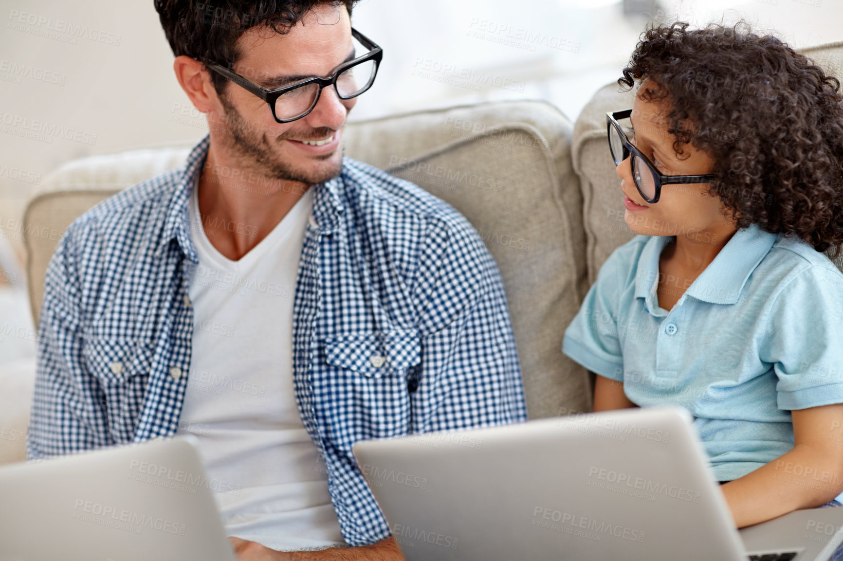Buy stock photo Laptop, relax and happy family dad, kid or home people smile for e learning, care or father helping son with child development. Elearning, remote online education and man enjoy bonding time with kid