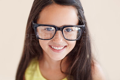 Buy stock photo Smile, glasses and portrait of girl child with optical care, health and wellness in a studio. Happy, optometry and face of kid with spectacles for vision with positive, good and confident attitude.