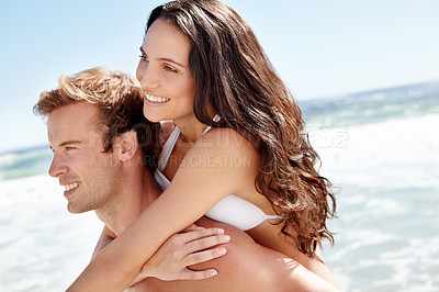 Buy stock photo Embrace, piggy back and happy couple on beach for holiday adventure together on tropical island. Smile, man and woman on ocean vacation with waves, hug and blue sky on romantic travel in Indonesia.