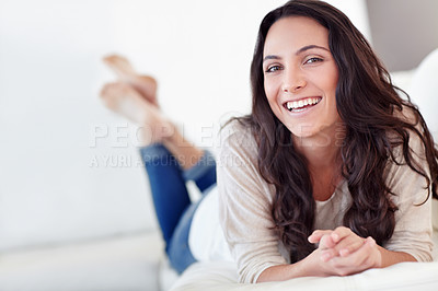 Buy stock photo Woman, portrait and relax on sofa with happiness, wellness and leisure in comfortable in apartment. Greek female person and glow face with casual fashion, rest and weekend morning in holiday house