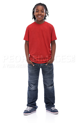 Buy stock photo A young African boy standing with his hands in his pockets smiling at the camera