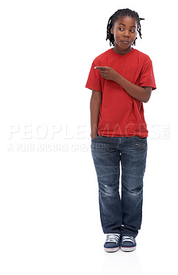 Buy stock photo Child, pointing and smile for advertising and announcement with comedy in a studio. Happy, showing and emoji hand gesture of African male boy with casual fashion with direction and white background