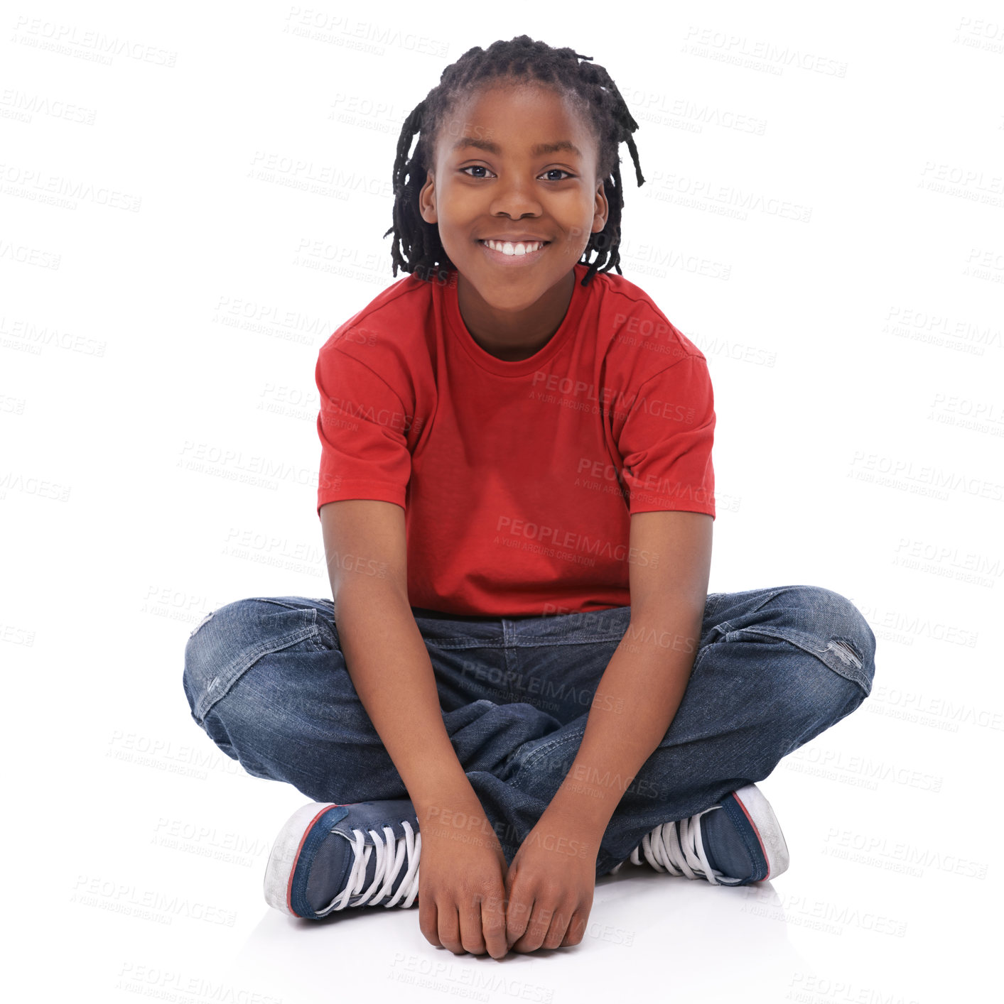 Buy stock photo Boy, child and portrait, smile in studio with casual clothes for fashion, positive mood and childhood on white background. T-shirt, jeans and simple outfit, African kid or youth sitting down