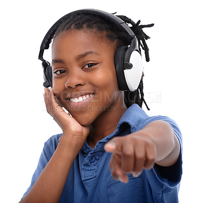 Buy stock photo Portrait, headphones and pointing with boy black child in studio isolated on white background for sound or audio. Face, music and happy, cool or confident african kid  streaming or listening to radio