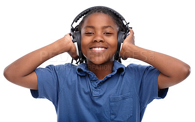 Buy stock photo Child, music and smile with portrait and headphones with audio in a studio. Happy, fun listening and streaming radio of African male boy with casual fashion and podcast sound by a white background