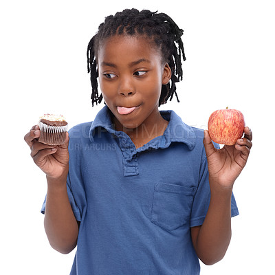 Buy stock photo Kid, apple and cupcake in studio with thinking for chocolate, sugar or diet for nutrition. Black child, planning and decision with choice for lifestyle, fruit or sweet dessert on white background