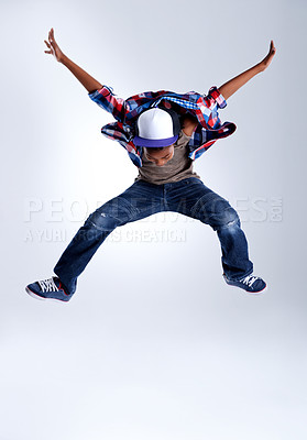 Buy stock photo Talent, jump and child hip hop dancer dancing isolated in a white studio background in a pose feeling excited. Dance, jumping and boy kid with energy and skill ready for breakdance performance