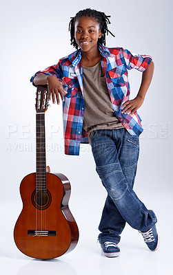Buy stock photo Music, studio and portrait of child with guitar and smile playing song isolated on white background. African boy, artist and creative kid in practice with acoustic instrument, inspiration or talent