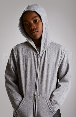 Buy stock photo Fashion, portrait and teenager in hoodie at studio with serious kid in streetwear on grey background. African, child and cool boy with casual style, clothes and comfortable with outfit in mockup