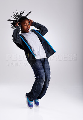 Buy stock photo A young boy hip-hop dancing in the studio