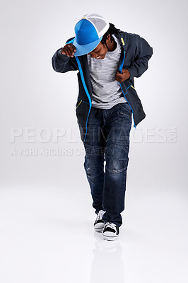 Buy stock photo Child, smile and dancing with hiphop and street style clothing in a studio with boy dancer. Trendy, energy and cool African kid with youth and rap music with white background and gen z clothes