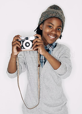 Buy stock photo Photographer, portrait or happy kid in studio with camera isolated on white background for creative talent. Photography, African boy or child artist with hobby, smile or picture ready for photoshoot