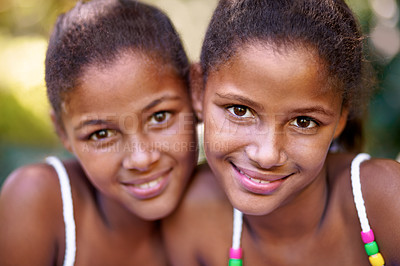 Buy stock photo Portrait of two twin sisters standing together outside