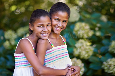 Buy stock photo Portrait of two twin sisters standing together outside