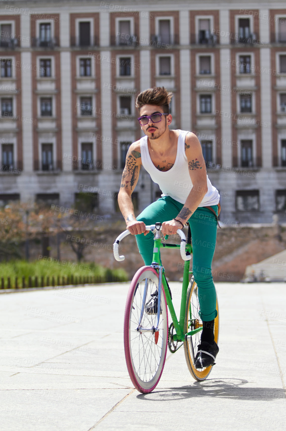 Buy stock photo Bicycle, fitness and young man in city for travel and carbon footprint, gen z streetwear and casual fashion. Cool person or student in sunglasses and bike transport for exercise at campus building
