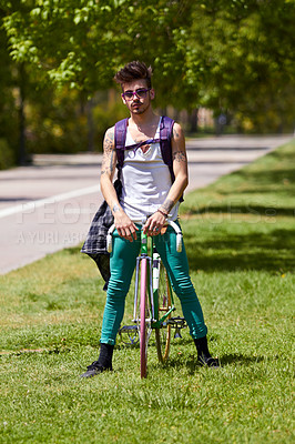 Buy stock photo Fashion, street wear and man with a bicycle in a city for eco friendly or sustainable transport on urban background. Style, attitude and male person posing with a bike for cycling, commute or travel