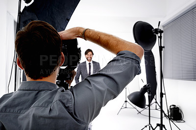Buy stock photo Back, model and photographer in studio, gear and pose with confidence and professional with equipment. Employee, freelancer and entrepreneur with lighting and campaign with style, tools and portfolio